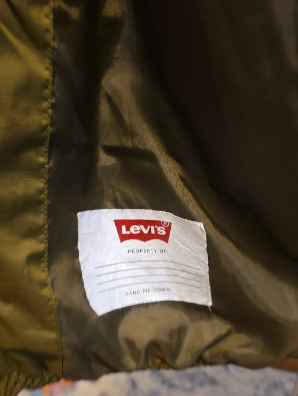 Levi's Olive Green Kids Puffer Jacket with Red and White Hood Trim